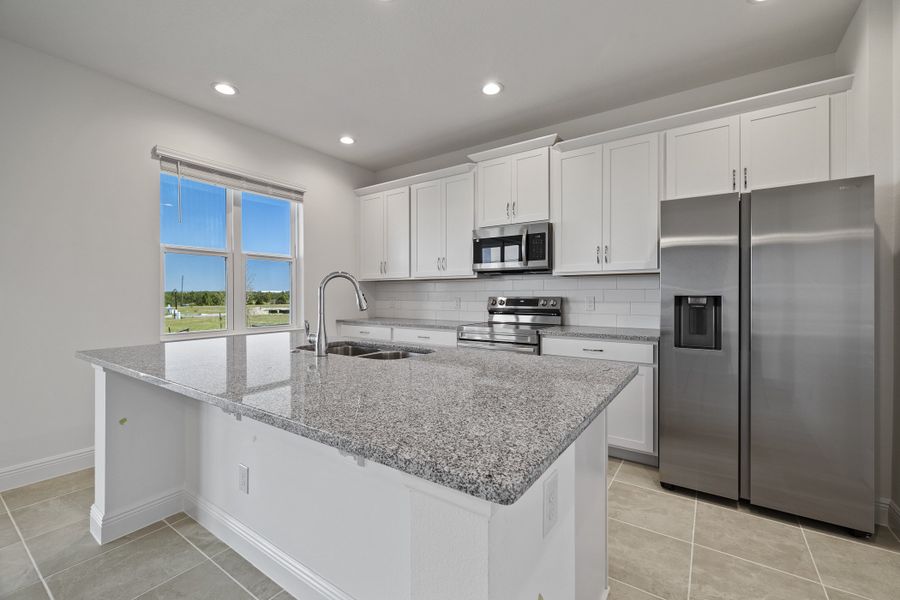 Representative furnished interior of a home built from the Newcastle by Risewell Homes in Trinity Lakes, Groveland (Image 5).