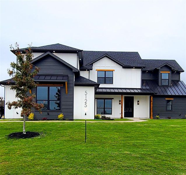 Modern farmhouse with a front yard