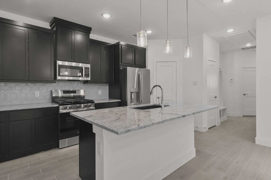 Representative furnished interior of a home built from the Carriagehouse by Chesmar Homes in Meridiana Townhomes, Iowa Colony (Image 57).