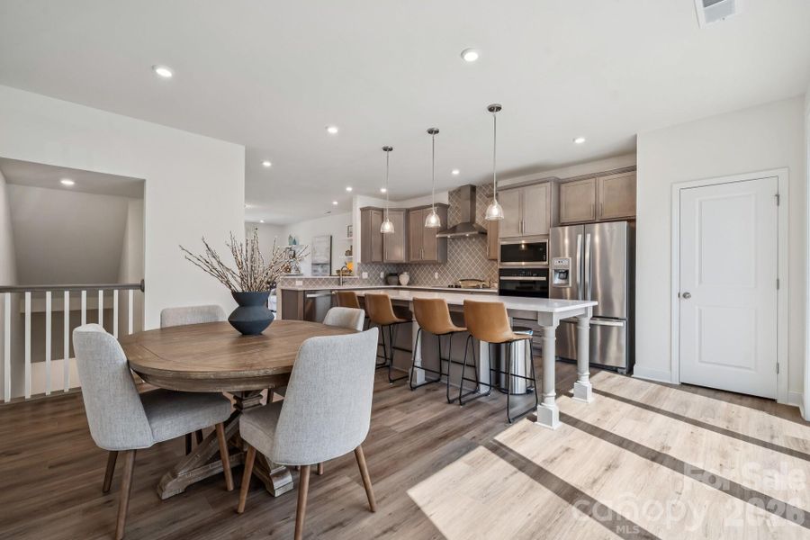 Dining in kitchen with large island. Wonderful natural lighrt