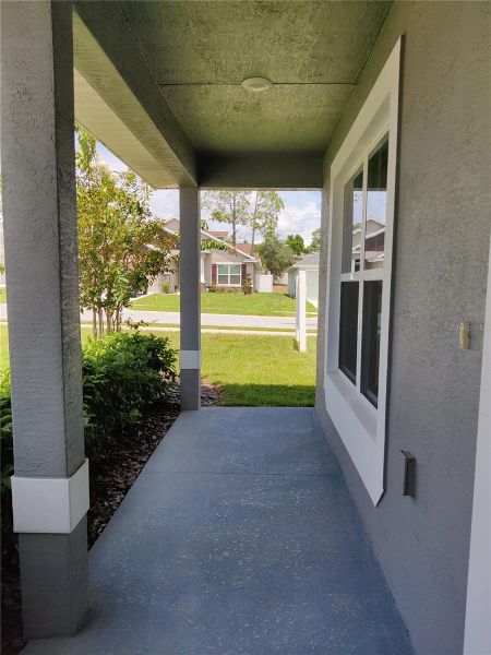 Exterior details and patio area of a home in Sunset Landing, Spring Hill (Image 3).