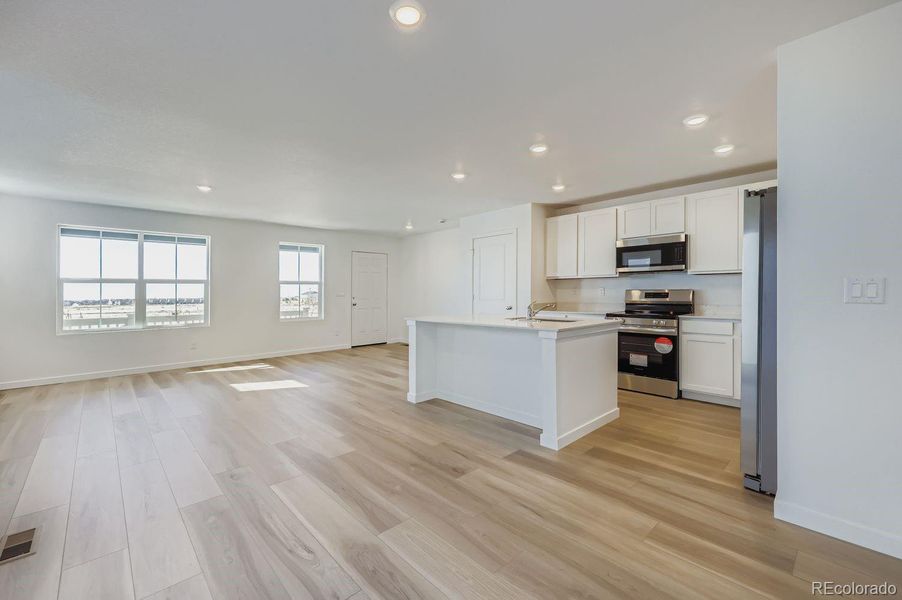 Spacious, unfurnished interior of a new home in Percheron: The Explorer Collection, Colorado Springs (Image 7).