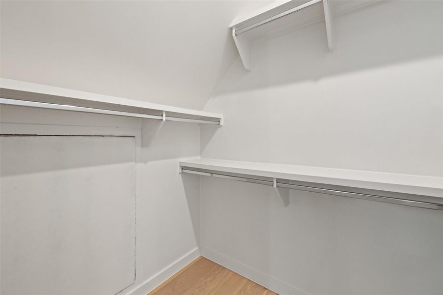 Walk in closet featuring light hardwood / wood-style floors