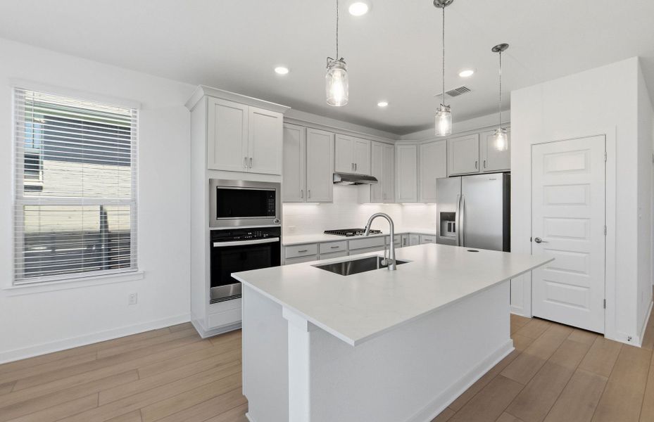 Furnished interior view inside a new home in Wolf Ranch, Georgetown (Image 13).