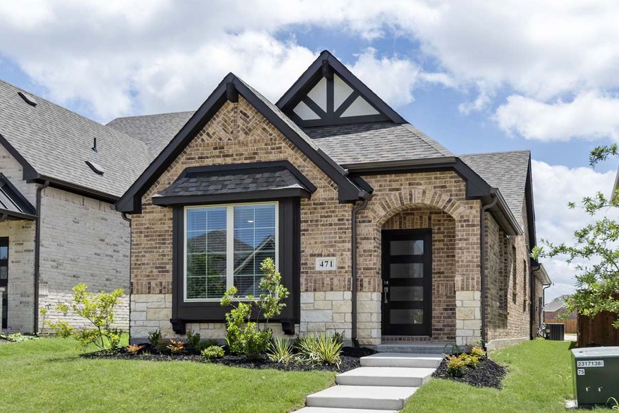 Front exterior of a new home in Elevon, Lavon, TX, highlighting curb appeal (Image 1). Front exterior of a new home in Elevon, Lavon, TX, highlighting curb appeal (Image 1).