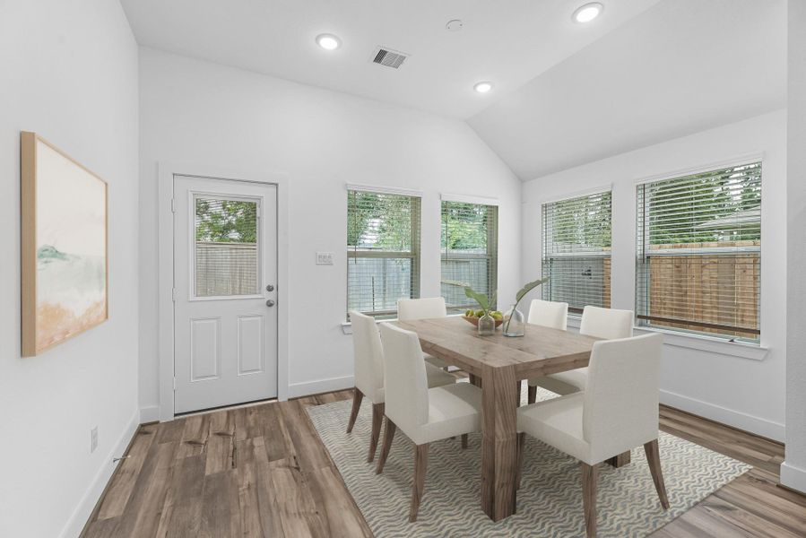 With an abundance of natural light streaming through the windows, the breakfast nook is bathed in a sunny glow, creating the perfect atmosphere to enjoy your morning coffee or a family breakfast.