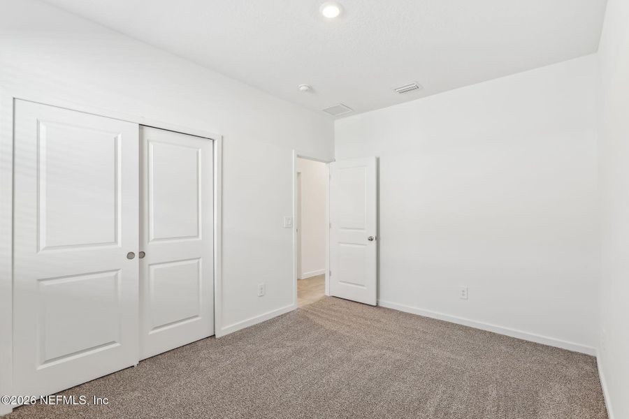 Spacious, unfurnished interior of a new home in Lakes at Bella Lago - Signature Series, Green Cove Springs (Image 26). Spacious, unfurnished interior of a new home in Lakes at Bella Lago - Signature Series, Green Cove Springs (Image 26).