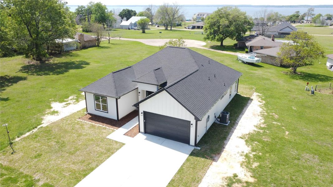 Front exterior of a new home in , Livingston, TX, highlighting curb appeal (Image 24). Front exterior of a new home in , Livingston, TX, highlighting curb appeal (Image 24).