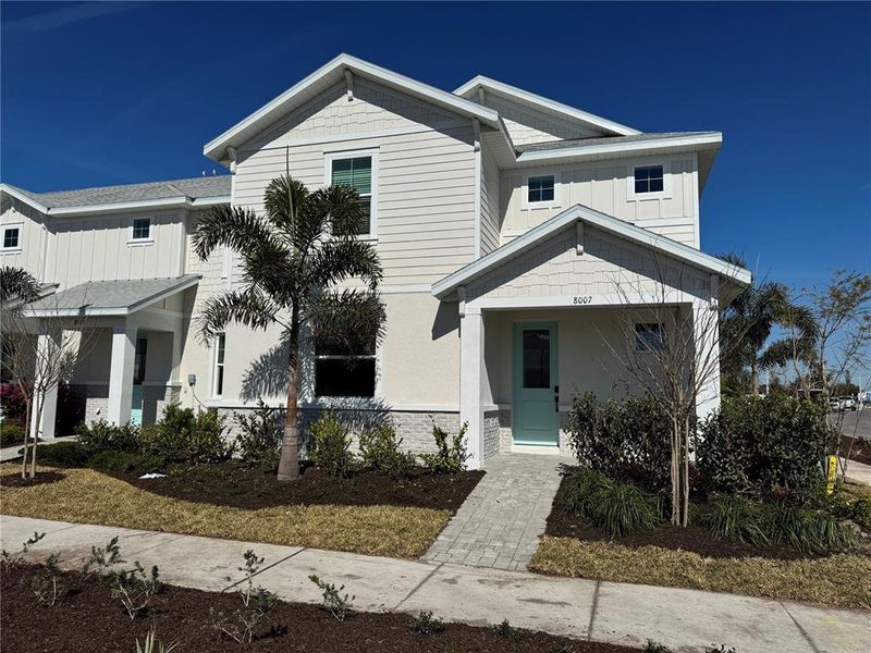 Front exterior of a new home in SeaFlower, Bradenton, FL, highlighting curb appeal (Image 19).