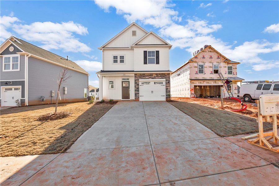 Front exterior of a new home in Brownstone Park, Easley, SC, highlighting curb appeal (Image 2).