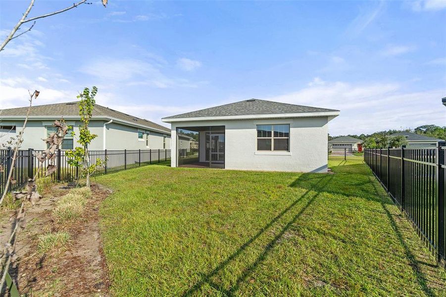 Exterior details and patio area of a home in Lakes at Harmony, Harmony (Image 4).