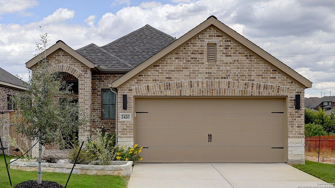 Front exterior of a new home in Ladera 40', San Antonio, TX, highlighting curb appeal (Image 21).
