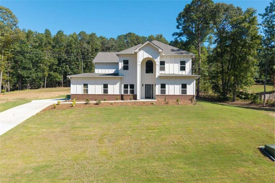 Front exterior of a new home in , Snellville, GA, highlighting curb appeal (Image 22).