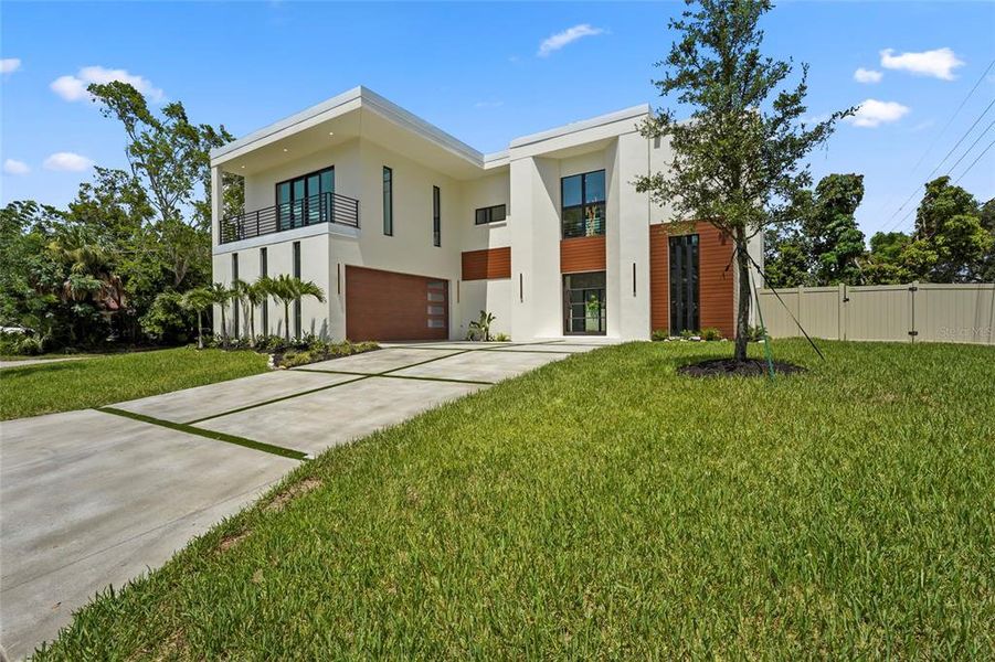 Front exterior of a new home in , Sarasota, FL, highlighting curb appeal (Image 31).