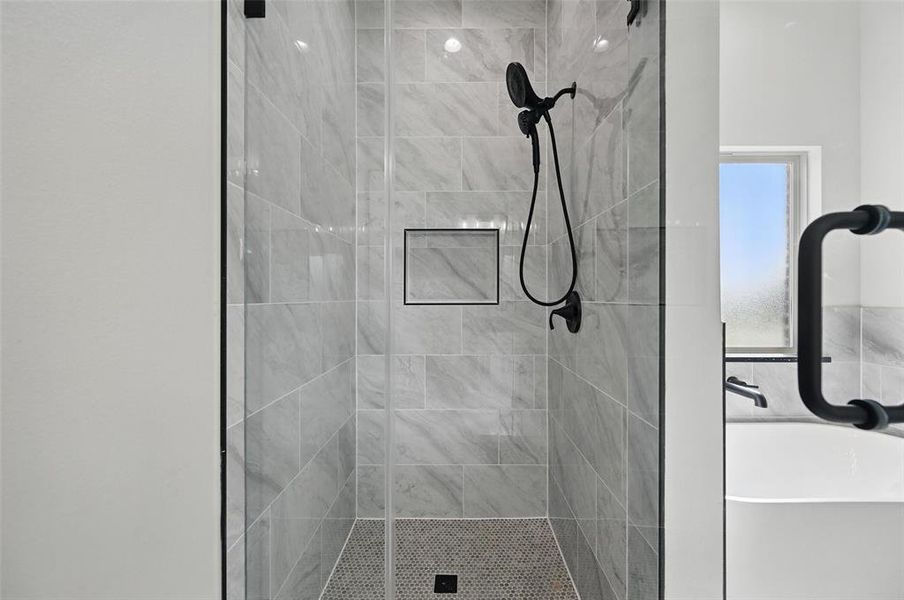 Bathroom featuring a shower stall Bathroom featuring a shower stall