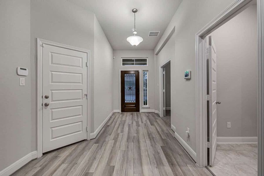 Representative unfurnished interior of a home built from the Shenandoah by Chesmar Homes in Berry Creek Highlands, Georgetown (Image 7).