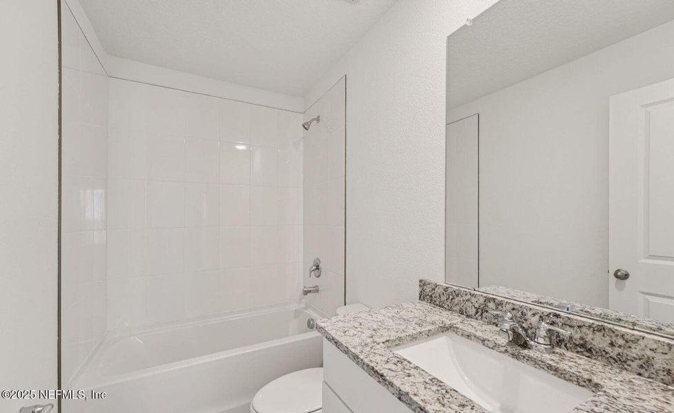 Furnished interior view inside a new home in Flagler Village - Classic Series, Palm Coast (Image 7). Furnished interior view inside a new home in Flagler Village - Classic Series, Palm Coast (Image 7).