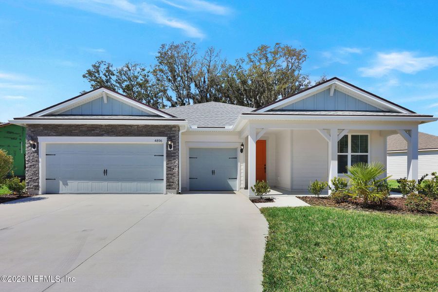 Front exterior of a new home in Wingate Landing, Jacksonville, FL, highlighting curb appeal (Image 1). Front exterior of a new home in Wingate Landing, Jacksonville, FL, highlighting curb appeal (Image 1).