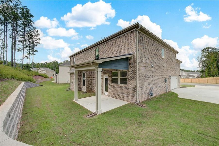 Front exterior of a new home in Trinity Park, McDonough, GA, highlighting curb appeal (Image 2).