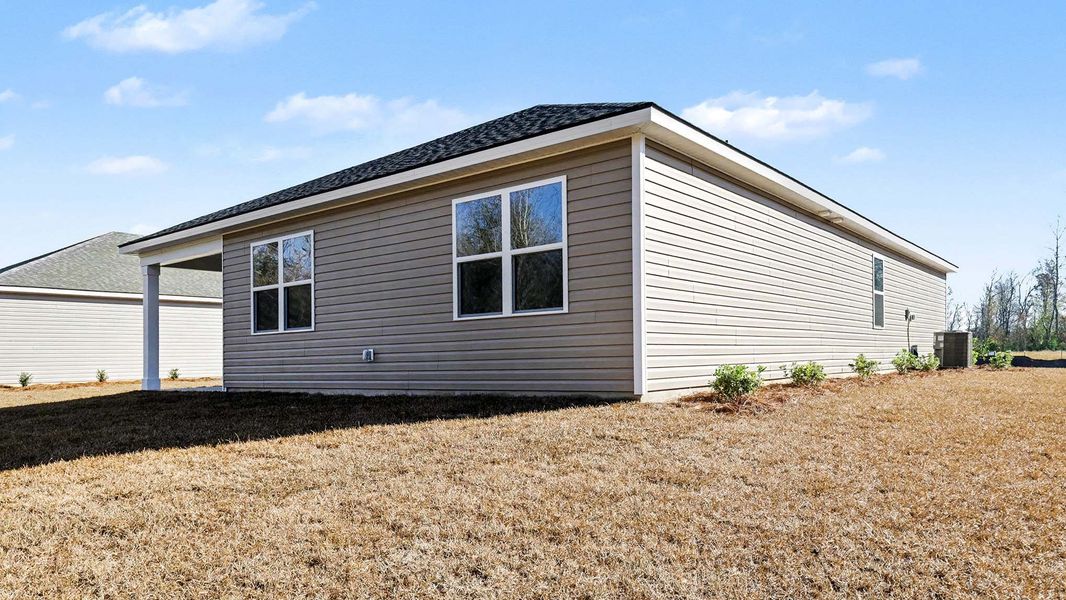 Exterior details and patio area of a home in Pinewood Estates, Conway (Image 4).