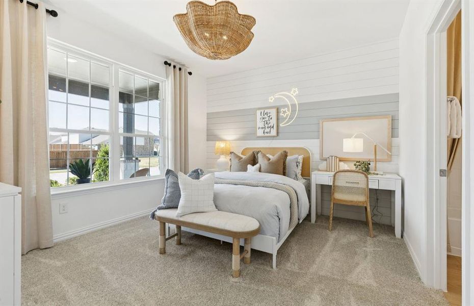 Spacious secondary bedroom with large windows *Model Representation*