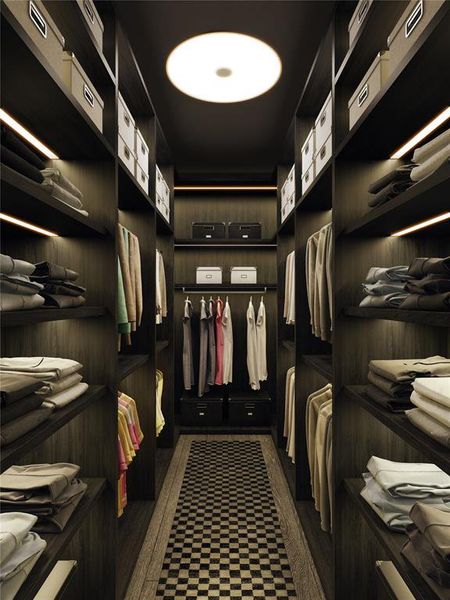 The primary closet showcases Boffi cabinetry with built-ins and generous hanging space, offering an experience akin to a high-end boutique. This meticulously designed area combines elegance and practicality, providing a stylish solution for organization.