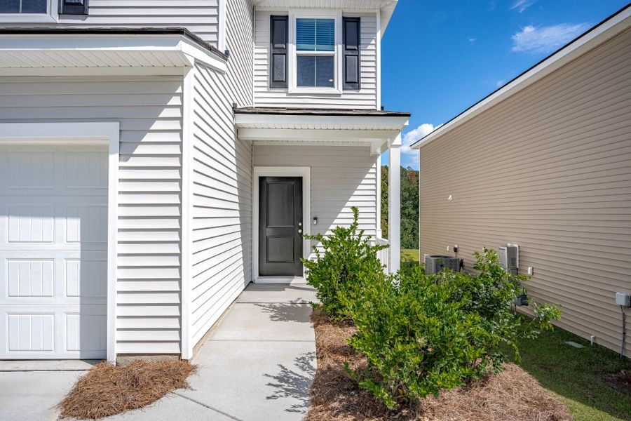 Exterior details and patio area of a home in Grand Arbor, Blythewood (Image 35).