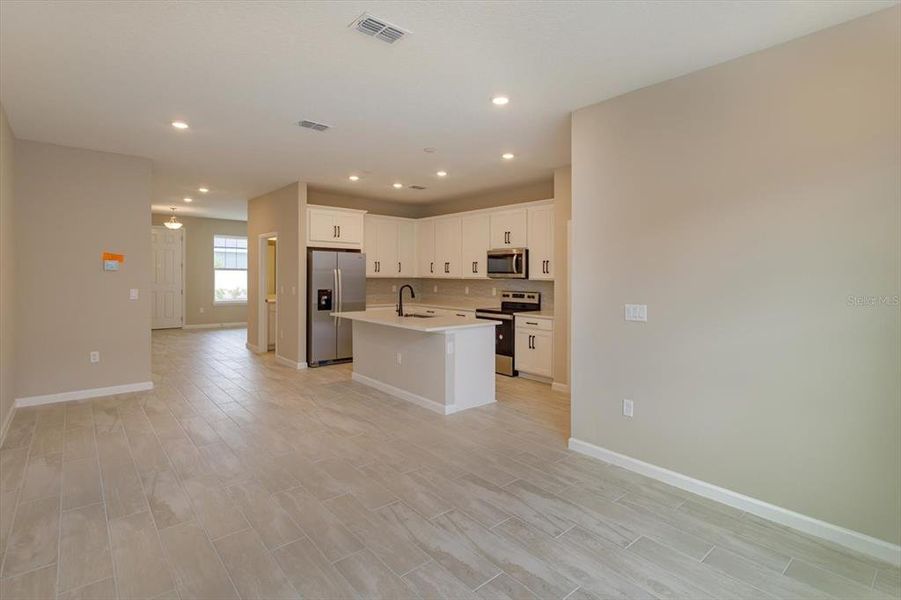 Furnished interior view inside a new home in Serenade at Ovation, Winter Garden (Image 15).