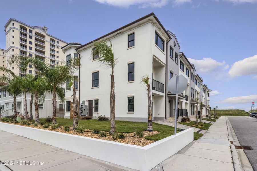 Front exterior of a home in the Pelican View Townhomes community, located in Jacksonville Beach, FL (Image 14). Front exterior of a home in the Pelican View Townhomes community, located in Jacksonville Beach, FL (Image 14).