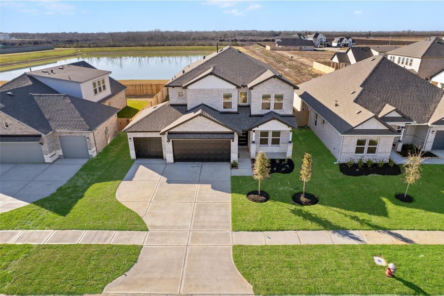 Front exterior of a new home in , Manvel, TX, highlighting curb appeal (Image 20).