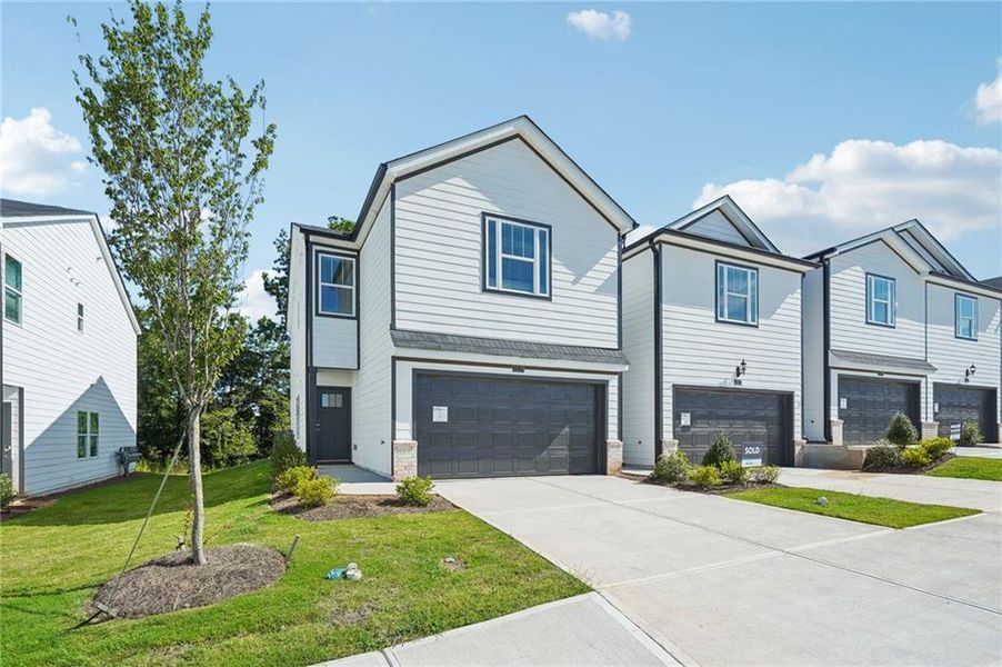 Front exterior of a new home in , Conyers, GA, highlighting curb appeal (Image 22).