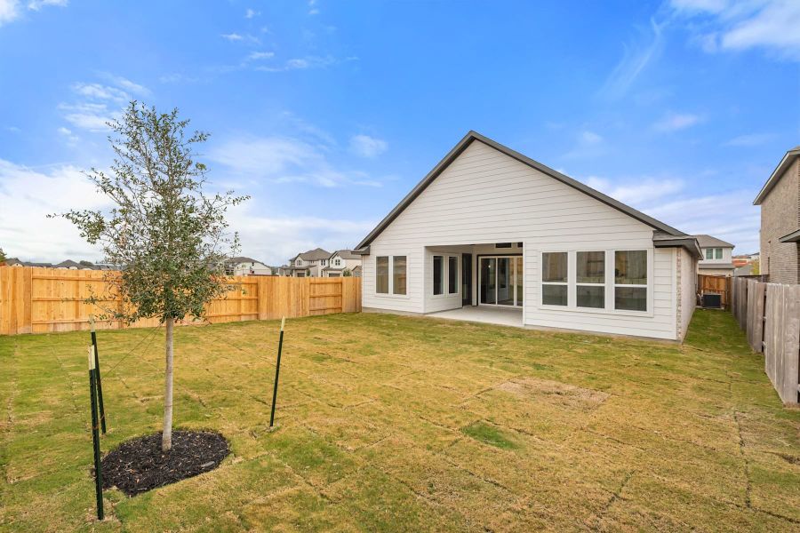 Exterior details and patio area of a home in Lariat, Liberty Hill (Image 29).