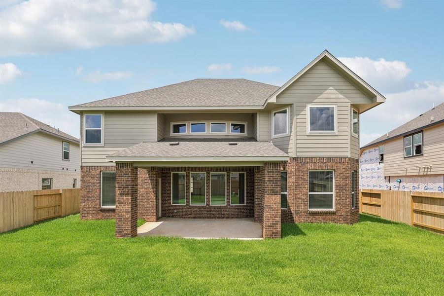 Front exterior of a new home in Kingdom Heights, Rosenberg, TX, highlighting curb appeal (Image 2). Front exterior of a new home in Kingdom Heights, Rosenberg, TX, highlighting curb appeal (Image 2).