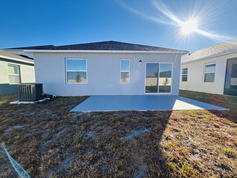 Exterior details and patio area of a home in Lake Deer Estates, Poinciana (Image 3).