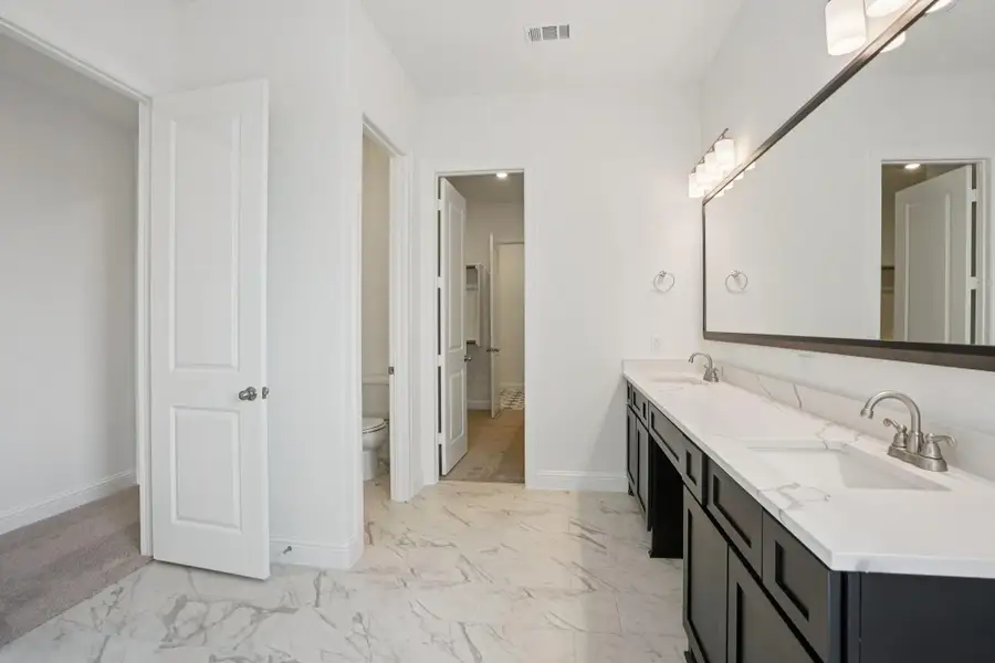 Furnished interior view inside a new home in Del Bello Lakes 60', Manvel (Image 11).