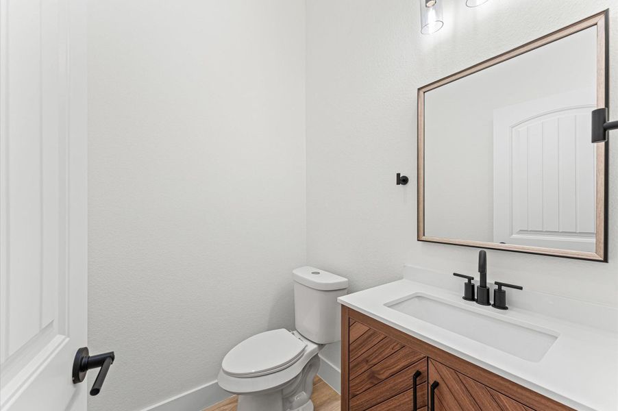 Half bathroom downstairs. Half bathroom downstairs.