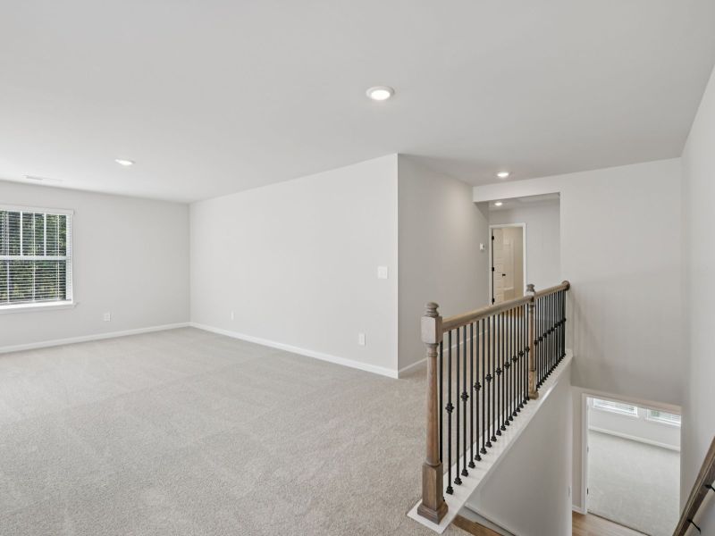 Spacious, unfurnished interior of a new home in Vines at Mill Creek - Estate Series, Braselton (Image 12).