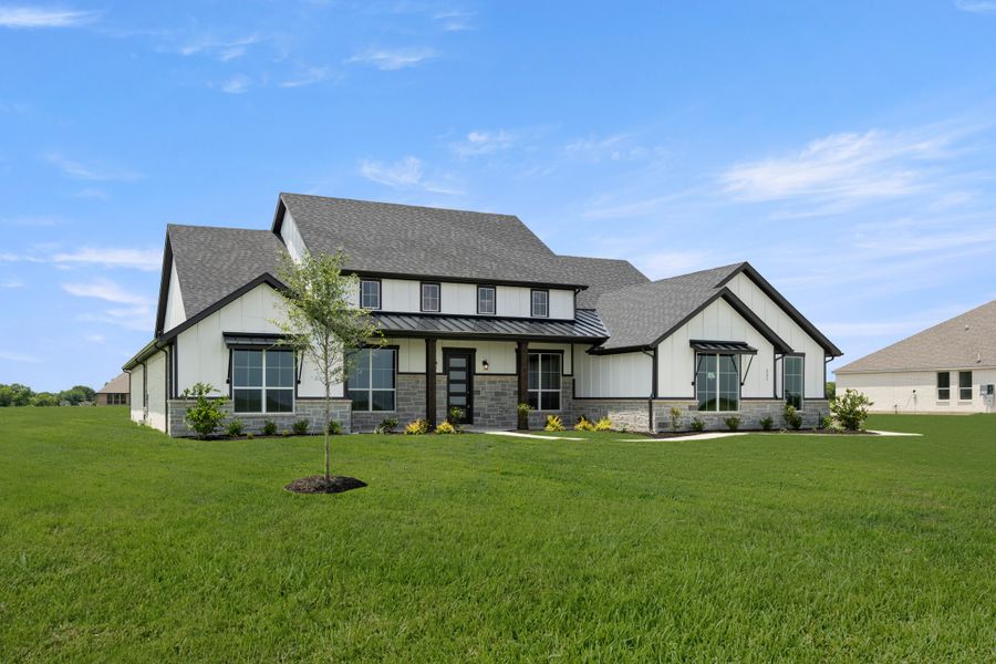 Front exterior of a new home in Pecan Acres, Red Oak, TX, highlighting curb appeal (Image 2). Front exterior of a new home in Pecan Acres, Red Oak, TX, highlighting curb appeal (Image 2).