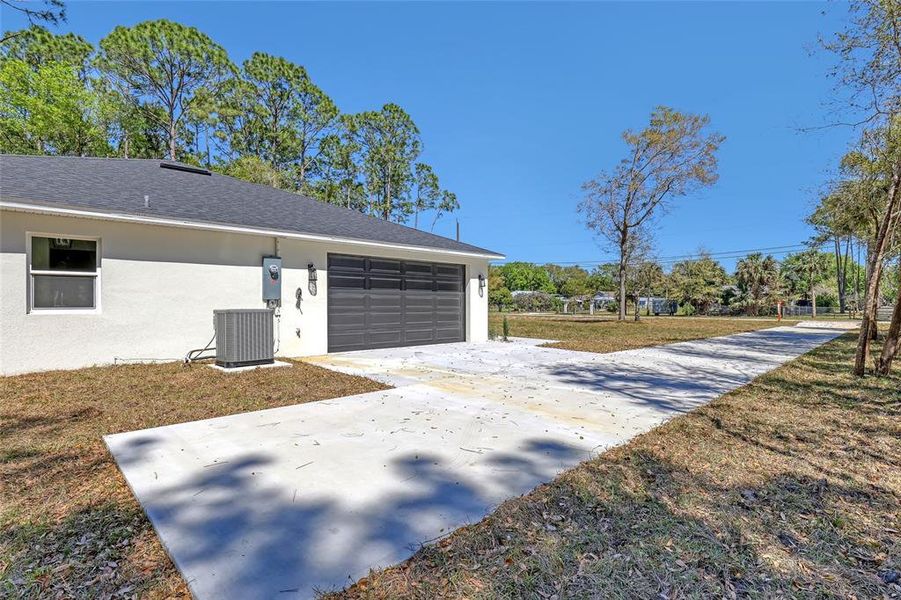 Front exterior of a new home in , Mims, FL, highlighting curb appeal (Image 25).