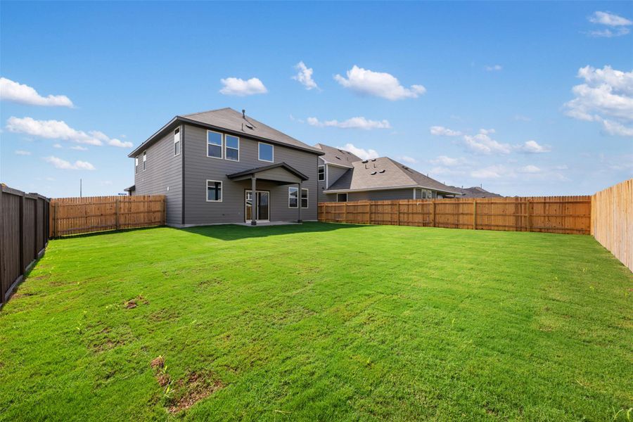 Exterior details and patio area of a home in Rolling Glen, Hutto (Image 21).