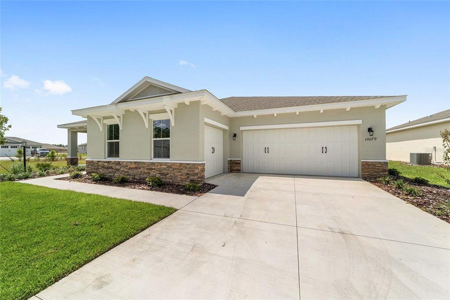 Front exterior of a new home in On Top of the World Communities, Ocala, FL, highlighting curb appeal (Image 18).