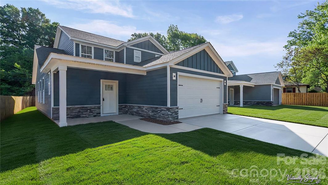 Front exterior of a new home in , Huntersville, NC, highlighting curb appeal (Image 3).