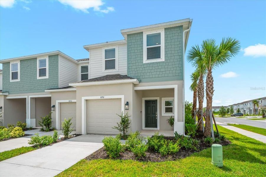 Front exterior of a new home in , Sarasota, FL, highlighting curb appeal (Image 23).