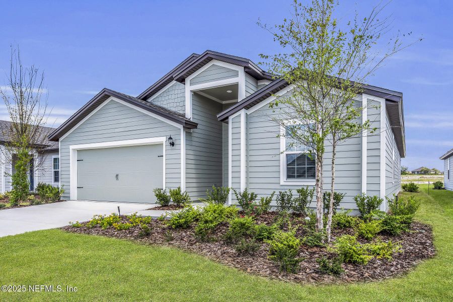 Front exterior of a new home in Rolling Hills, Green Cove Springs, FL, highlighting curb appeal (Image 1).