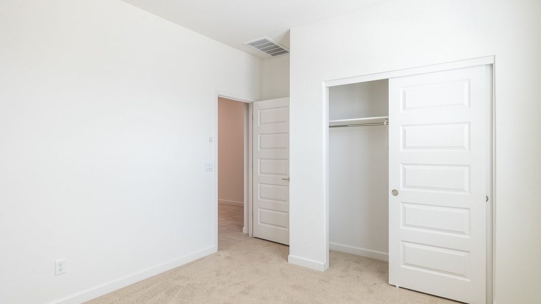 Spacious, unfurnished interior of a new home in Zanjero Pass, Waddell (Image 22).