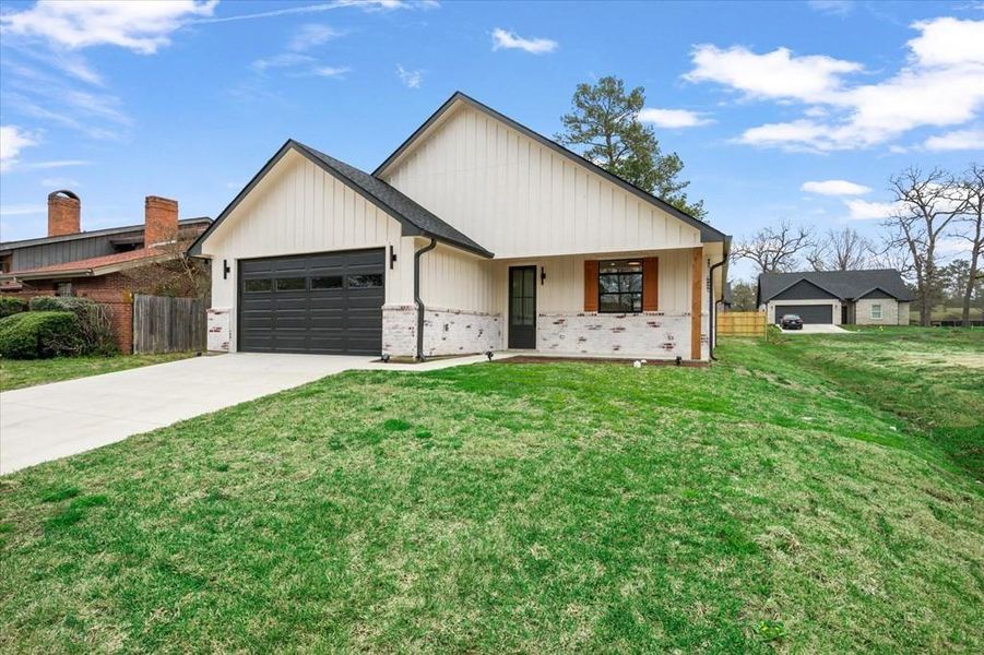 Front exterior of a new home in , Lufkin, TX, highlighting curb appeal (Image 30). Front exterior of a new home in , Lufkin, TX, highlighting curb appeal (Image 30).