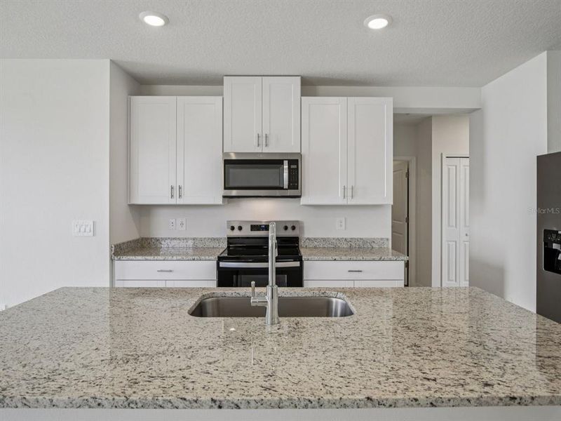 Furnished interior view inside a new home in Magnolia Bay - Premier Series, Nokomis (Image 7).