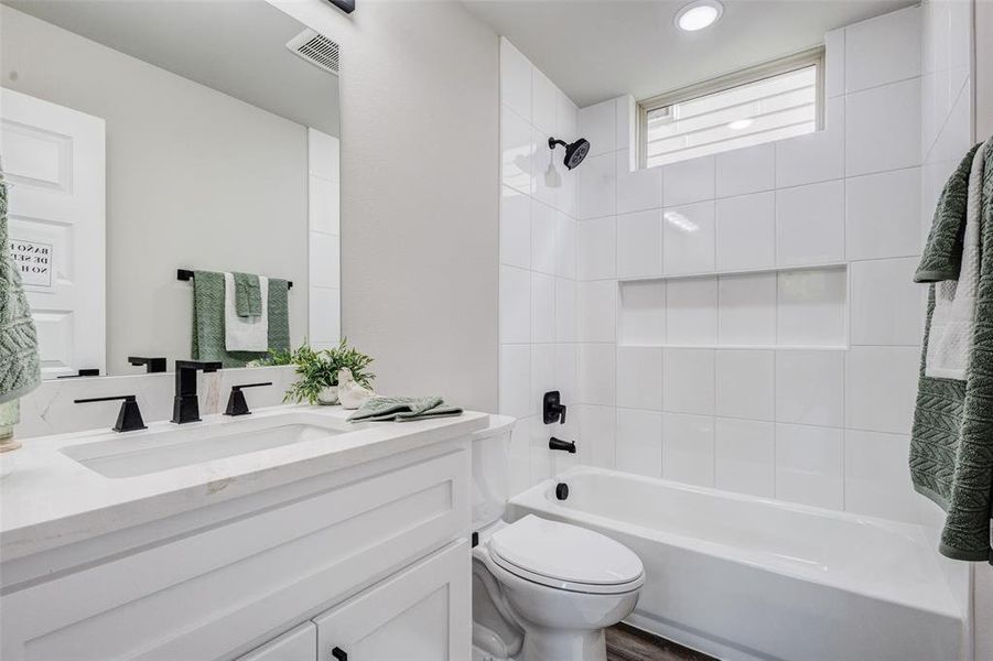 Full bathroom with vanity and bathtub / shower combination