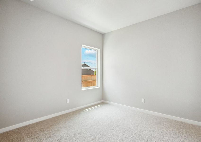 The secondary bedroom has carpet