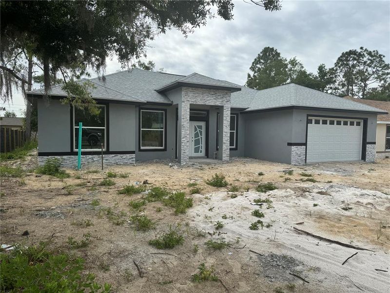 Front exterior of a new home in , Ocala, FL, highlighting curb appeal (Image 9).